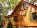 Hand hewed 2 x 8 log siding with log corners.