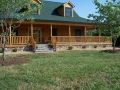 Custom log home with a great front porch located near Front Royal, VA.